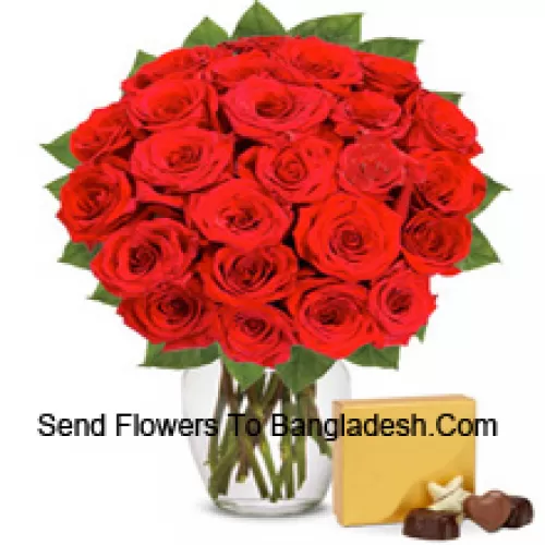 30 Red Roses With Some Ferns In A Glass Vase Accompanied With An Imported Box Of Chocolates