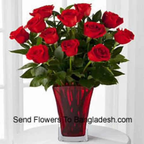 12 Red Roses With Some Ferns In A Vase